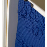 Close-up of a blue textured surface with a white border